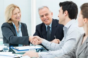 Successful Business Executives Shaking Hands With Each Other