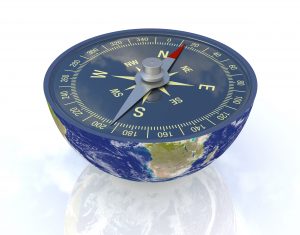 one earth globe divided into two parts, with a compass; concept of travel, but also as metaphor of finding the right way; earth map courtesy of nasa.gov  (3d render)